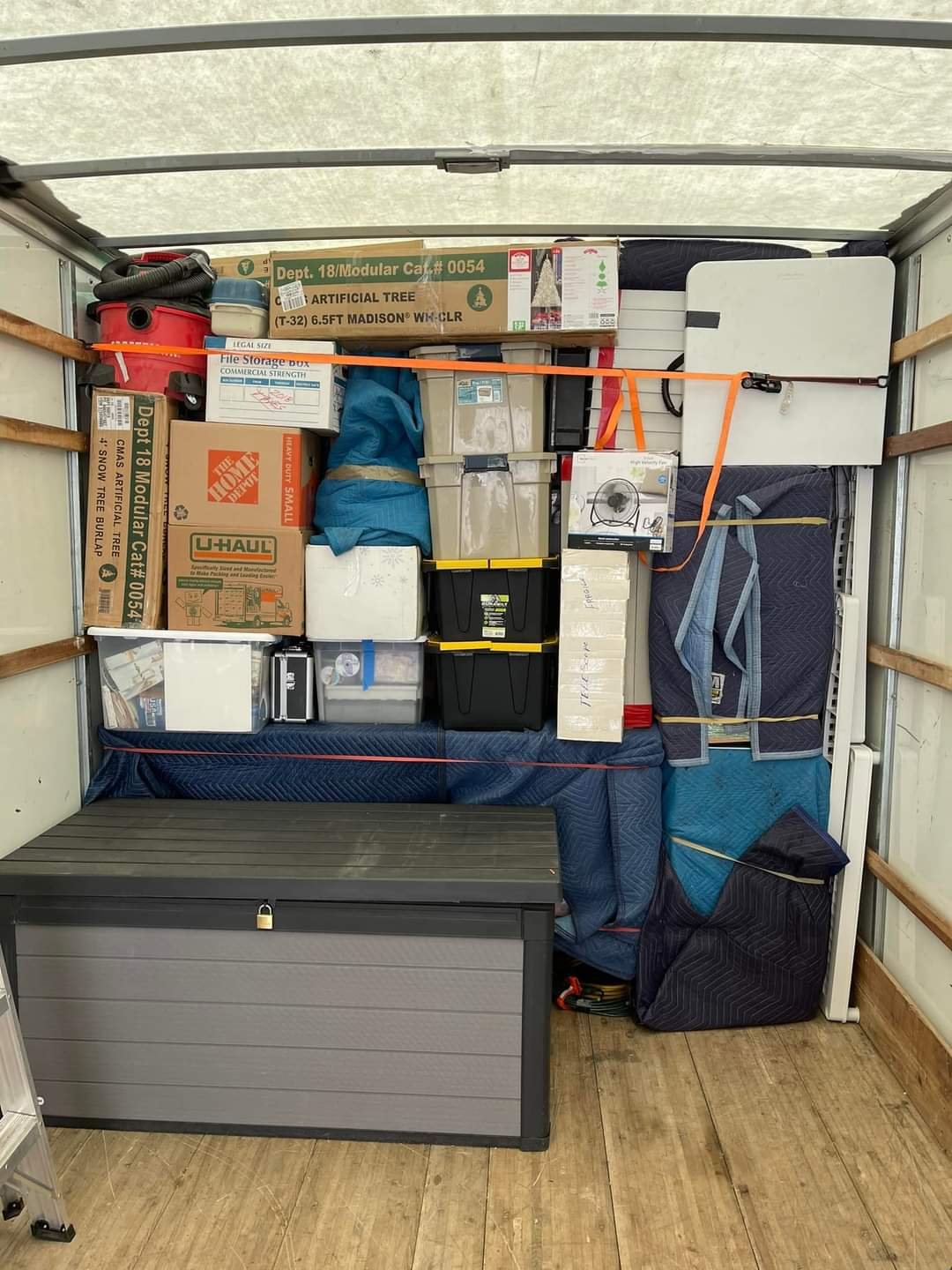 Moving truck loaded with furniture and boxes