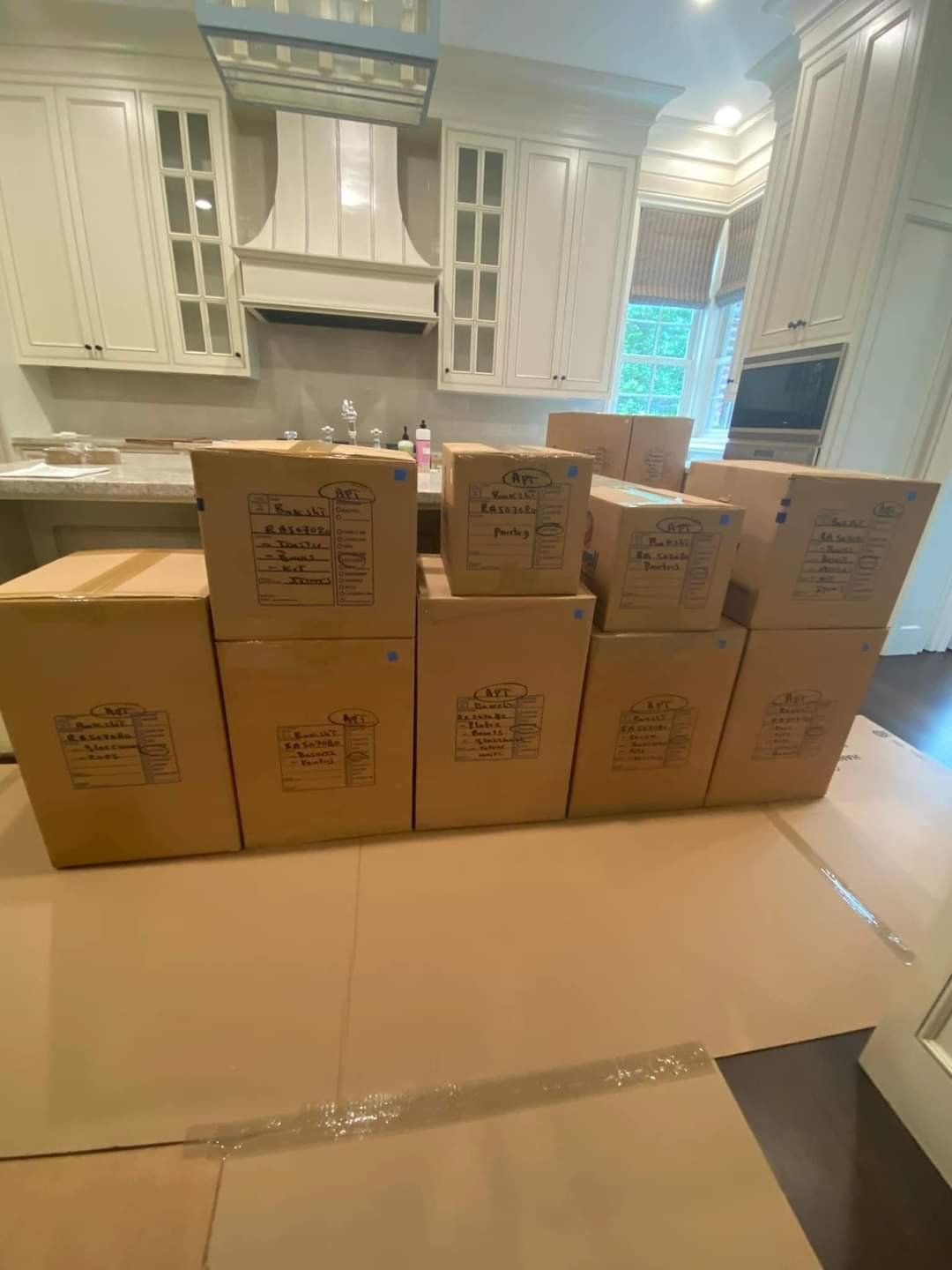 Stacked moving boxes in kitchen. moving company in Orange Park